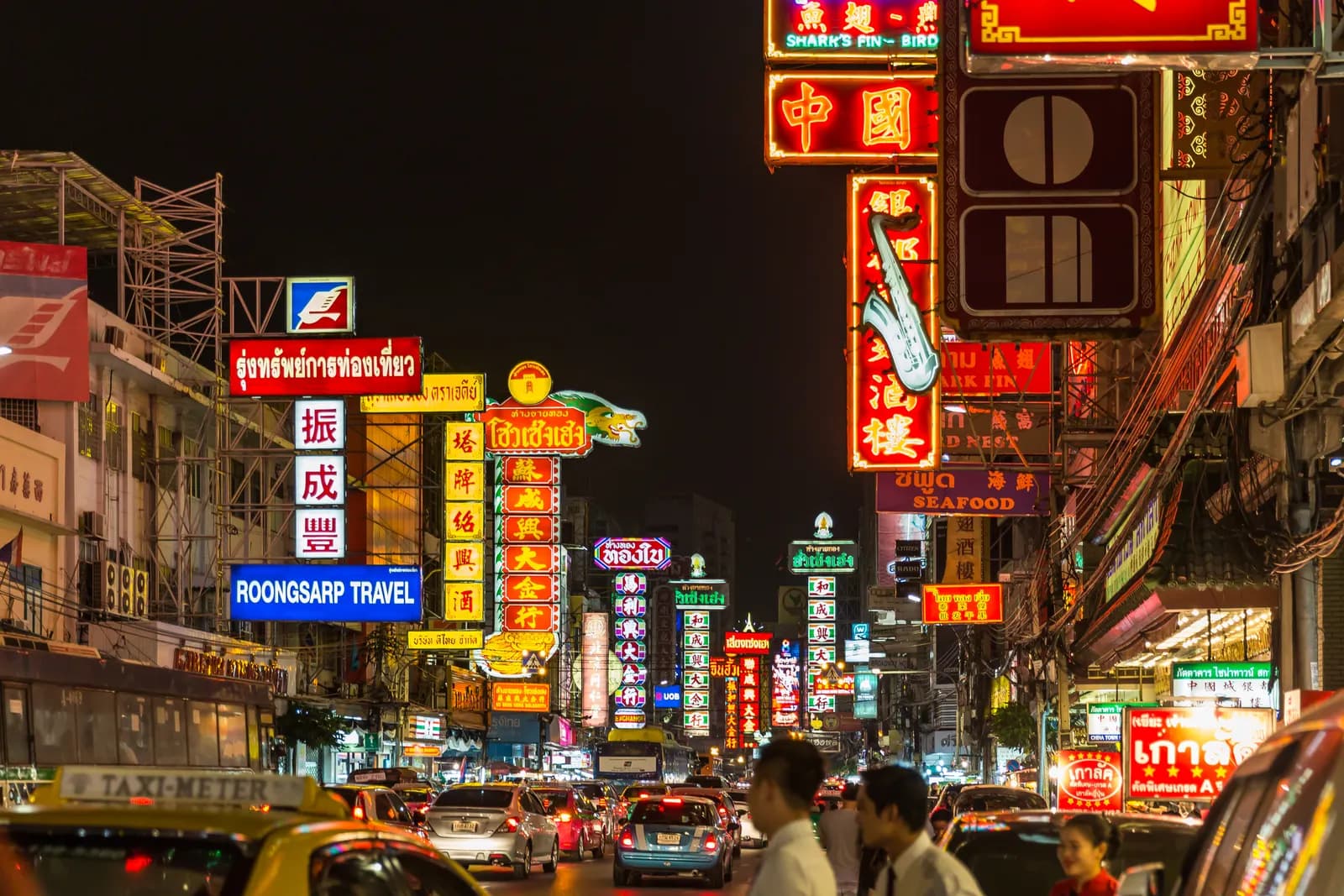 Neon signs over Yaowarat Road in Bangkok's Chinatown at night