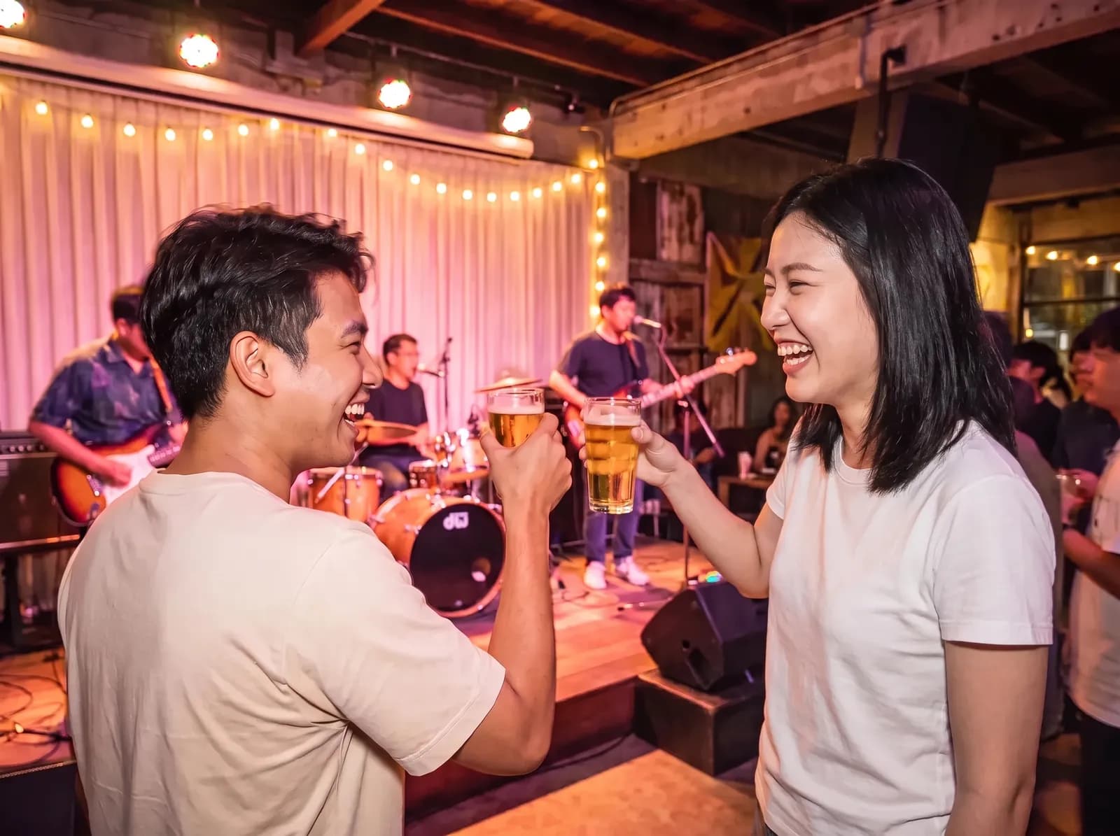 Two friends cheering at a live music bar in Bangkok