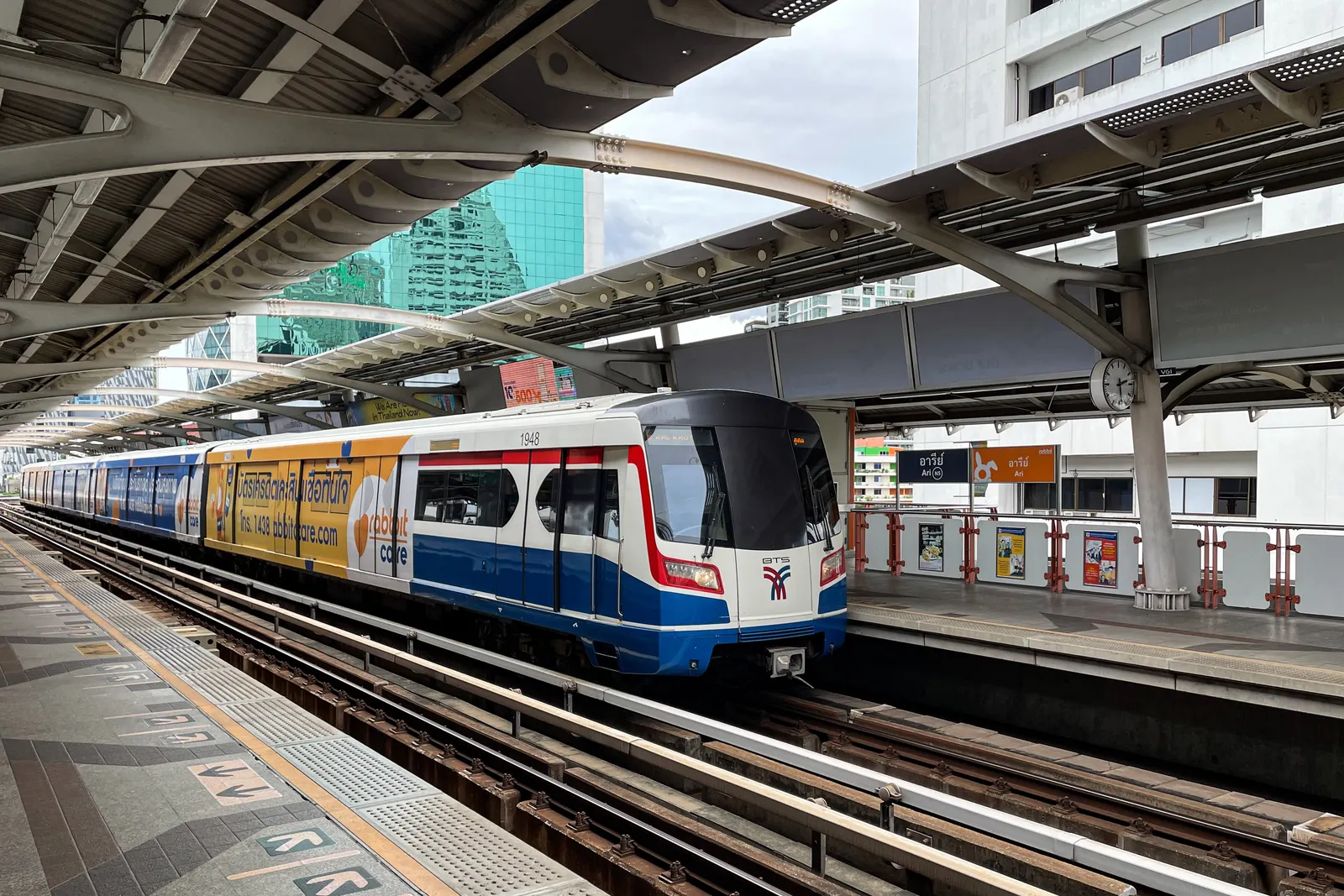 A Skytrain at the platform of BTS Ari station in Bangkok