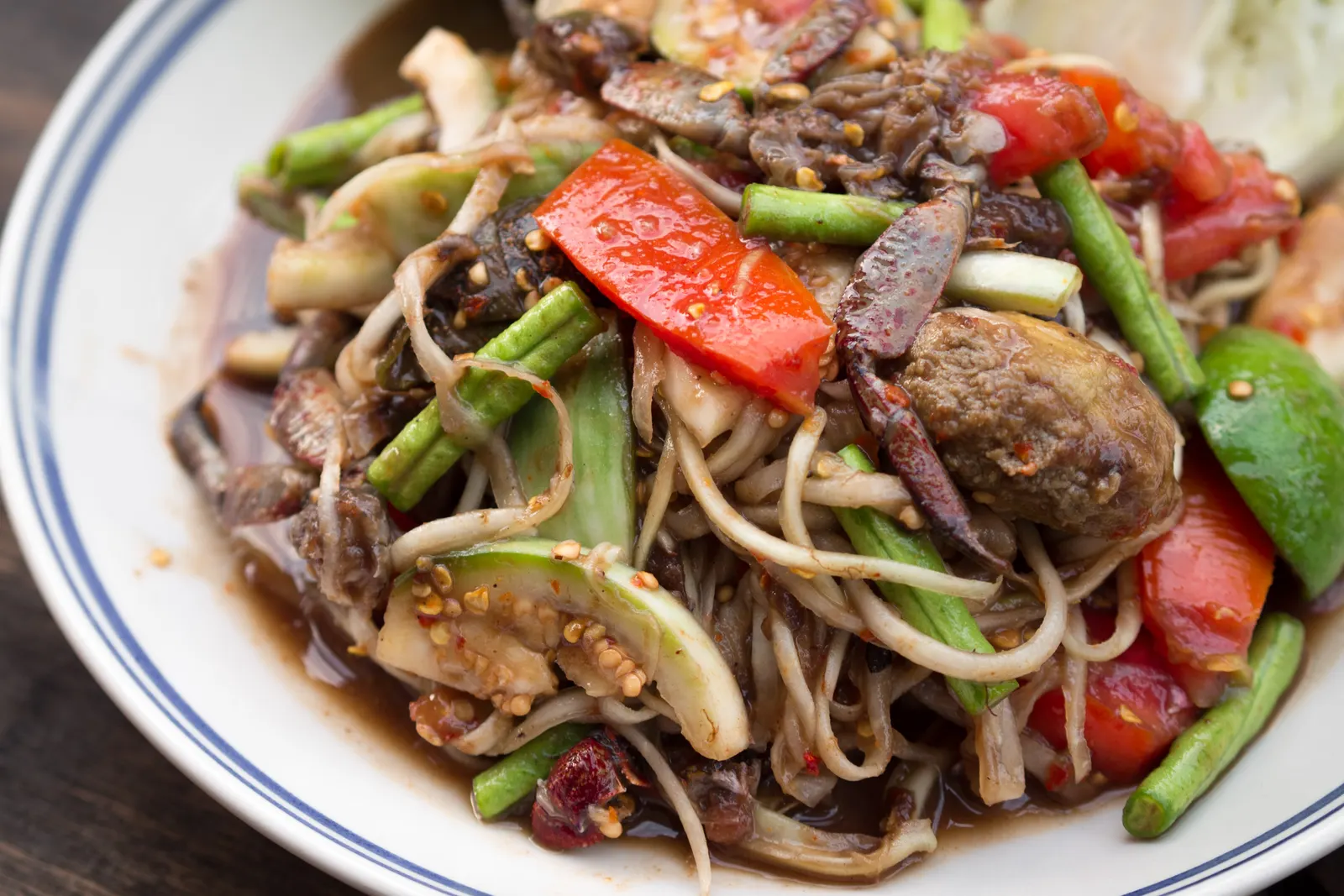 A plate of tam Lao, the Lao-style green papaya salad with pickled crab and fermented fish