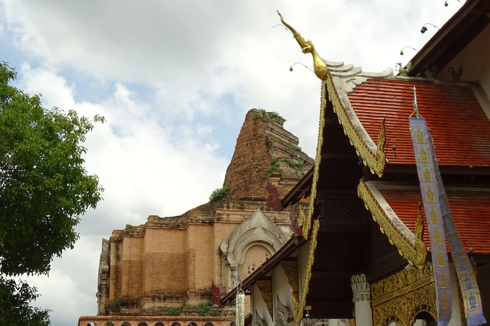 The ruined brick chedi of Wat Chedi Luang behind the roof of its assembly hall in Chiang Mai's Old City